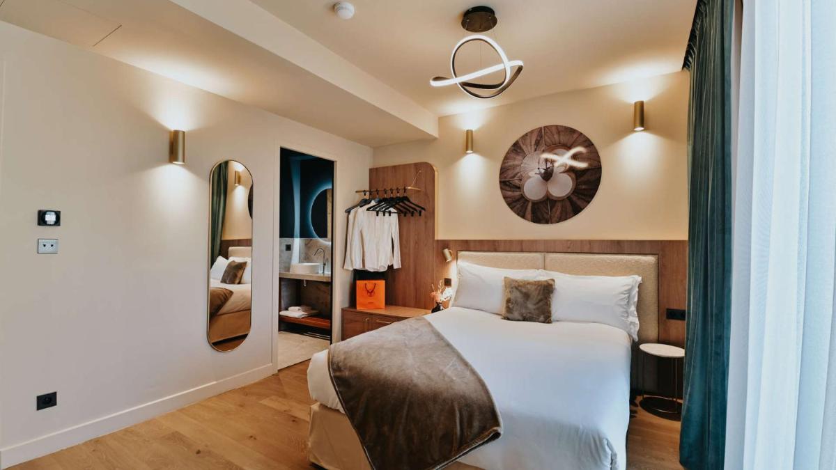 Un ou plusieurs lits dans un hébergement de l'établissement Keystone Hôtel & Spa