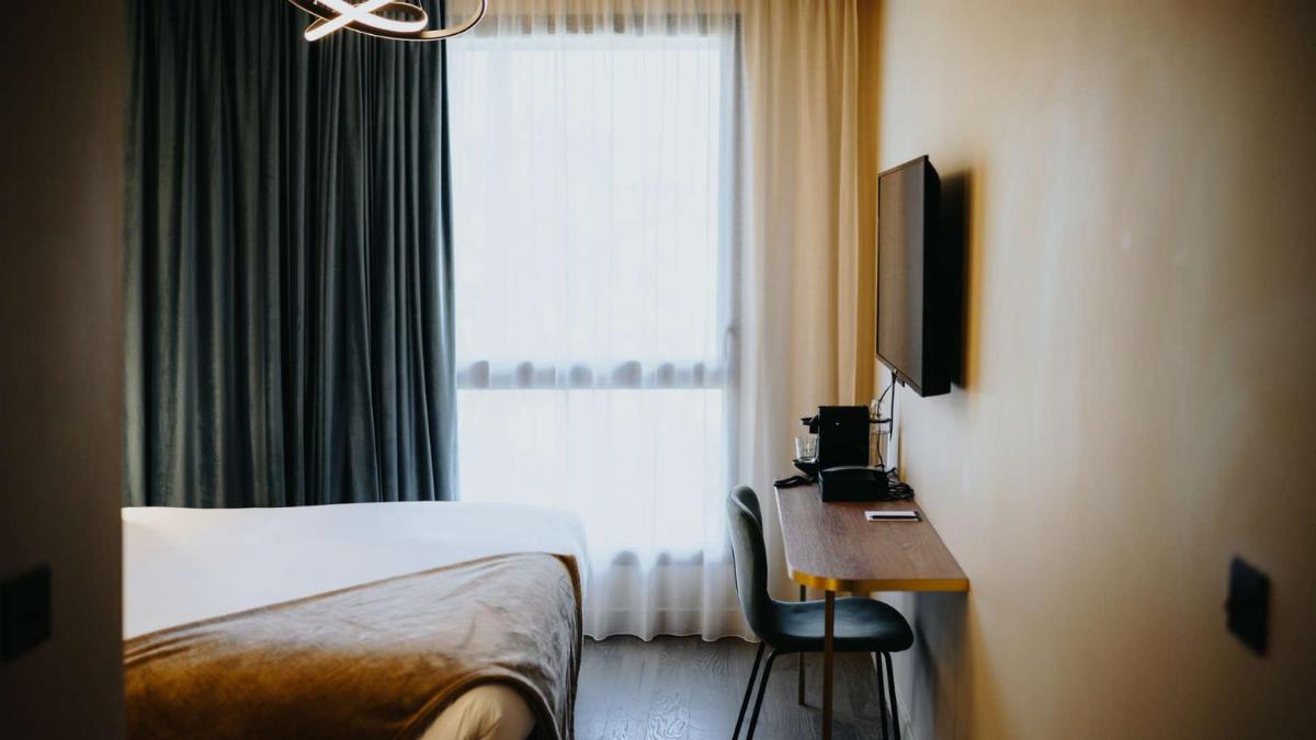 Un ou plusieurs lits dans un hébergement de l'établissement Keystone Hôtel & Spa
