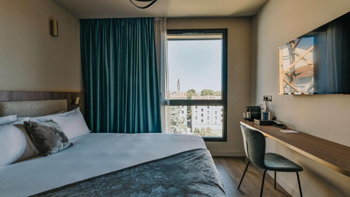 Un ou plusieurs lits dans un hébergement de l'établissement Keystone Hôtel & Spa