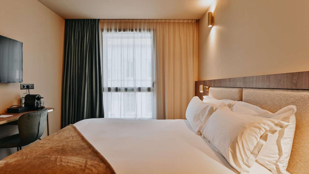 Un ou plusieurs lits dans un hébergement de l'établissement Keystone Hôtel & Spa