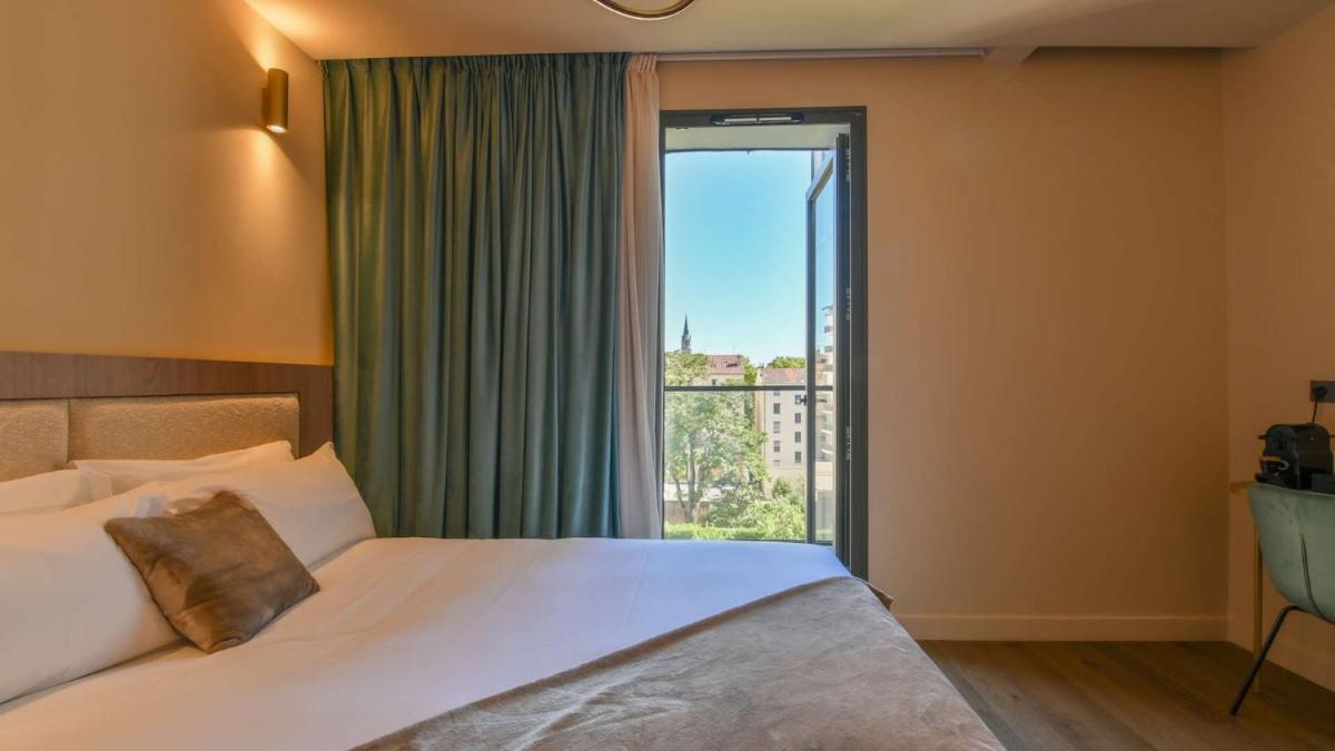 Un ou plusieurs lits dans un hébergement de l'établissement Keystone Hôtel & Spa