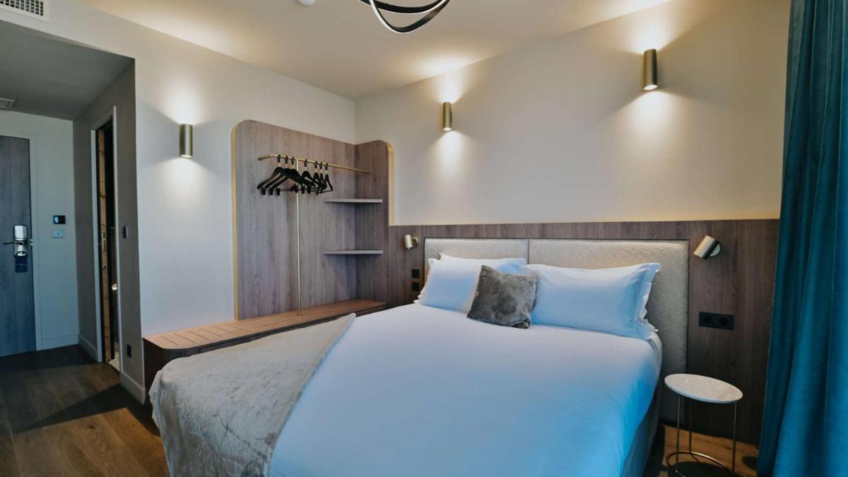 Un ou plusieurs lits dans un hébergement de l'établissement Keystone Hôtel & Spa