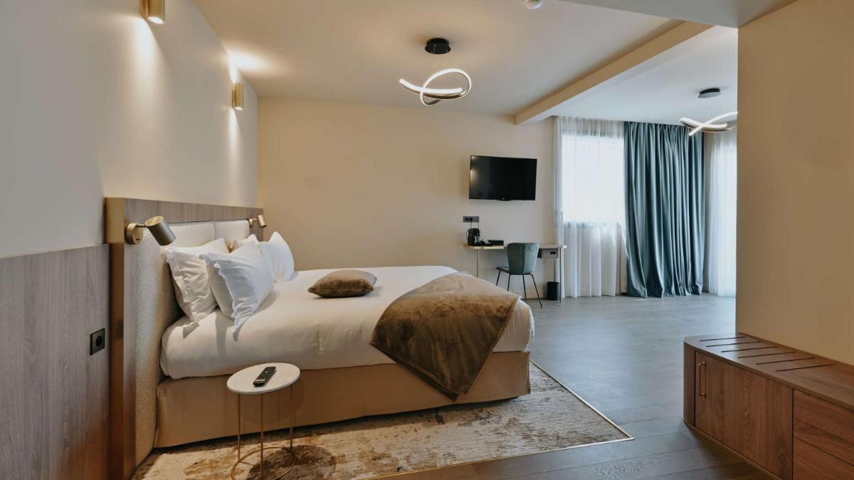 Un ou plusieurs lits dans un hébergement de l'établissement Keystone Hôtel & Spa