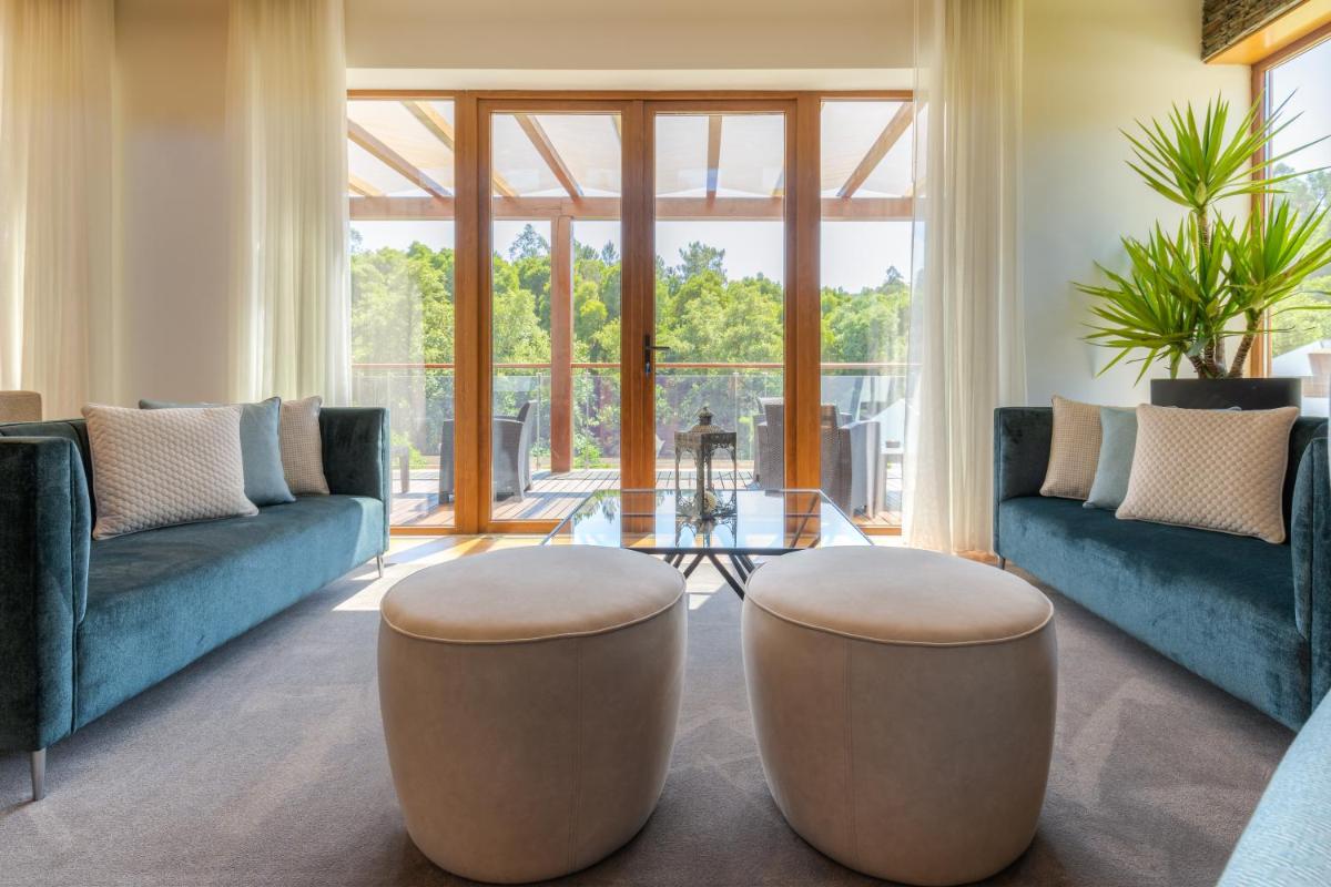 Uma área de estar em Hotel Rural Vale Do Rio