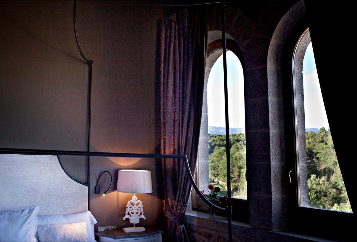 Cama o camas de una habitación en La Vella Farga Hotel