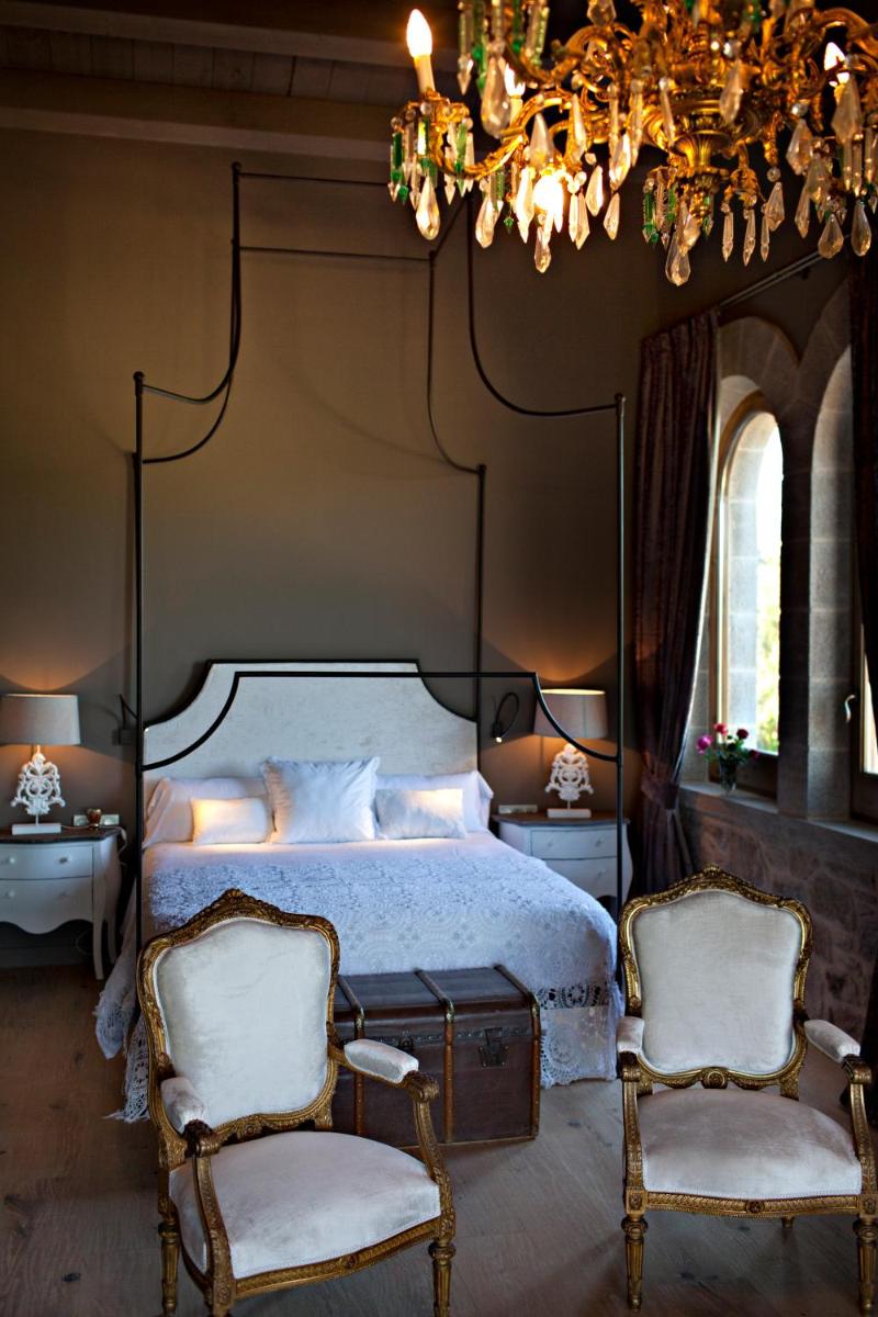 Cama o camas de una habitación en La Vella Farga Hotel