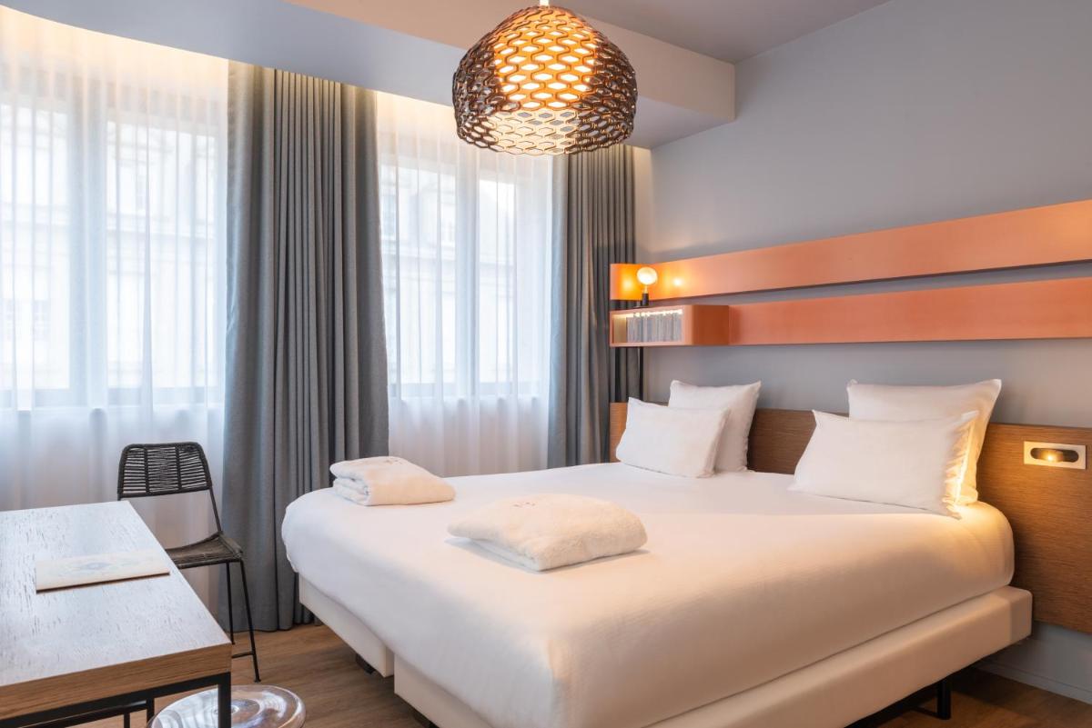 Un ou plusieurs lits dans un hébergement de l'établissement Golden Tulip Saint Malo– Le Grand Bé