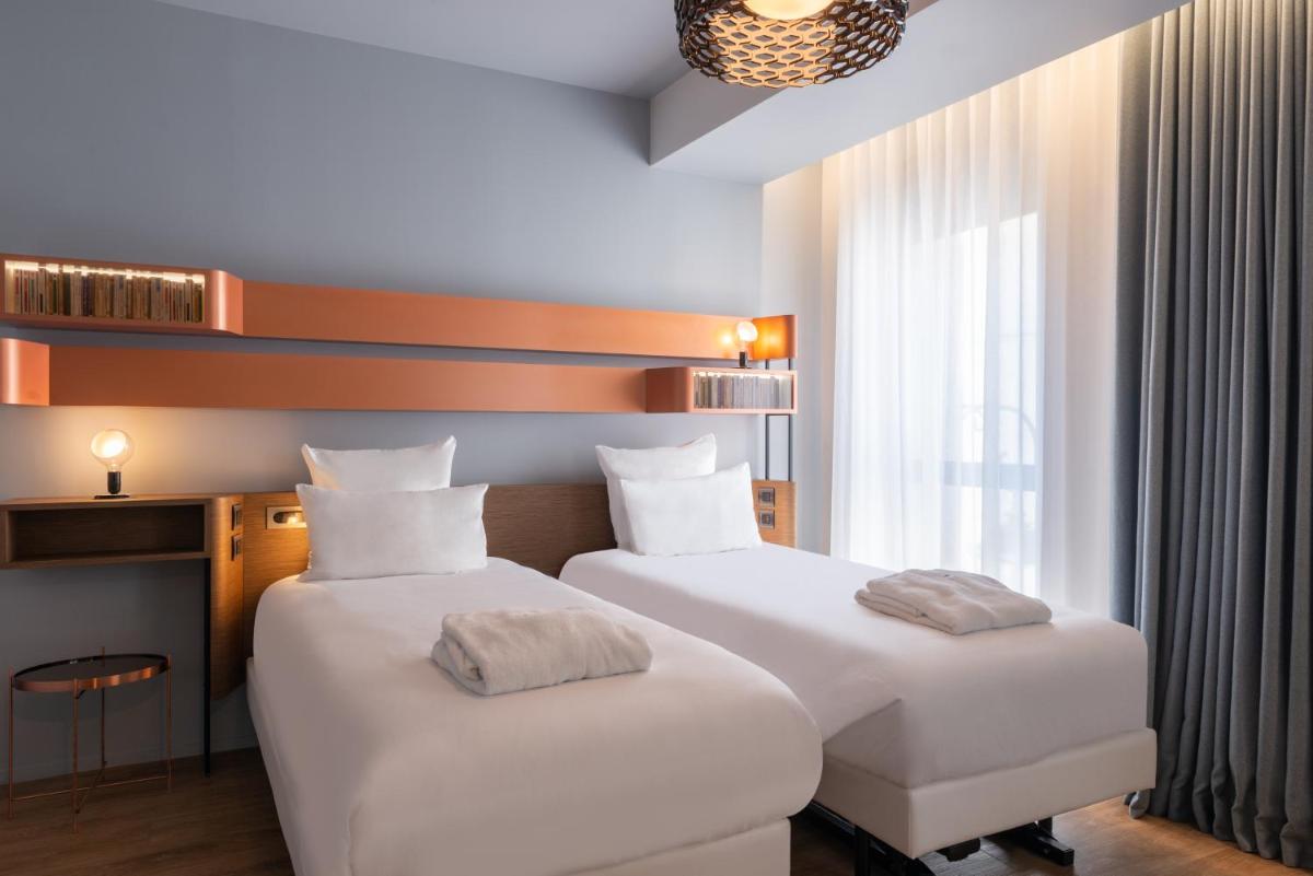 Un ou plusieurs lits dans un hébergement de l'établissement Golden Tulip Saint Malo– Le Grand Bé