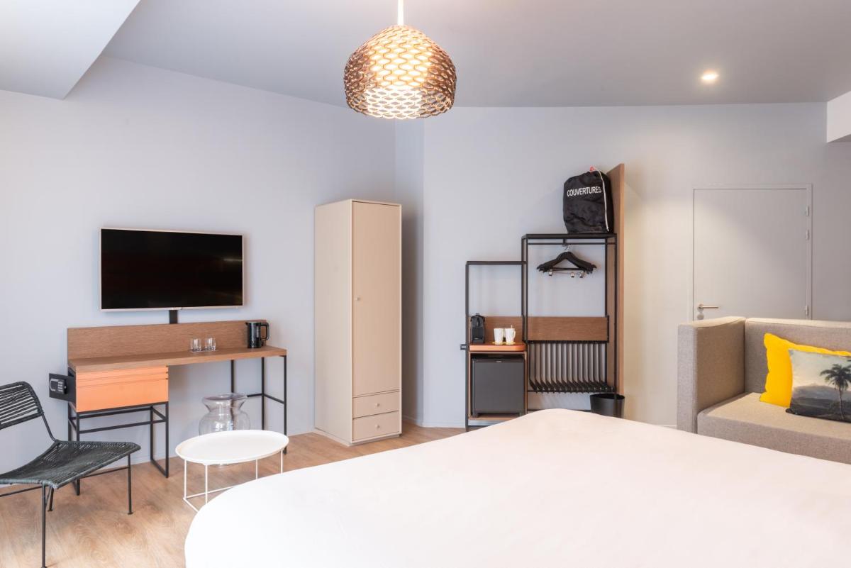 Un ou plusieurs lits dans un hébergement de l'établissement Golden Tulip Saint Malo– Le Grand Bé
