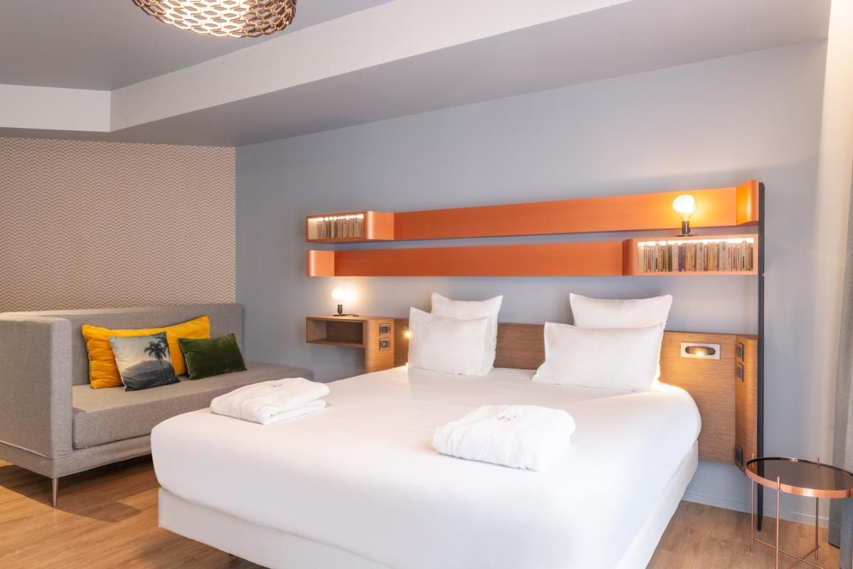 Un ou plusieurs lits dans un hébergement de l'établissement Golden Tulip Saint Malo– Le Grand Bé