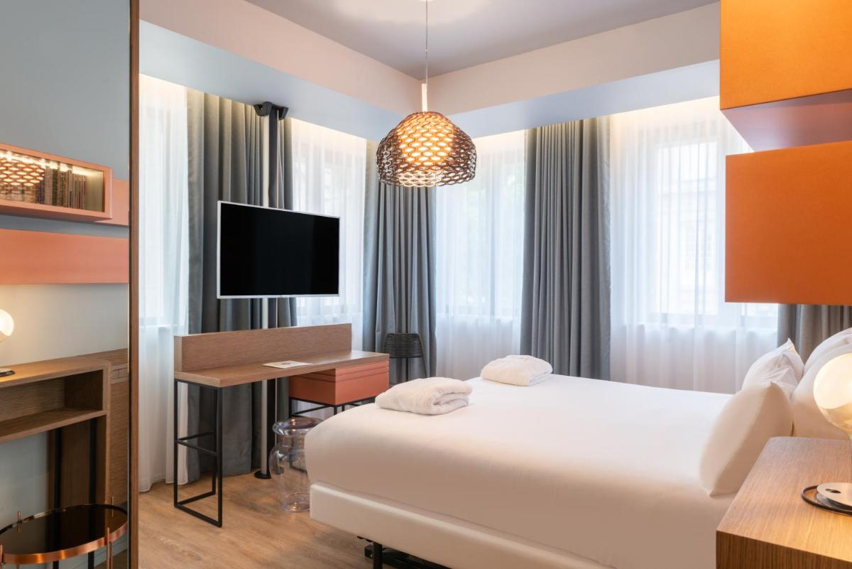 Télévision ou salle de divertissement dans l'établissement Golden Tulip Saint Malo– Le Grand Bé