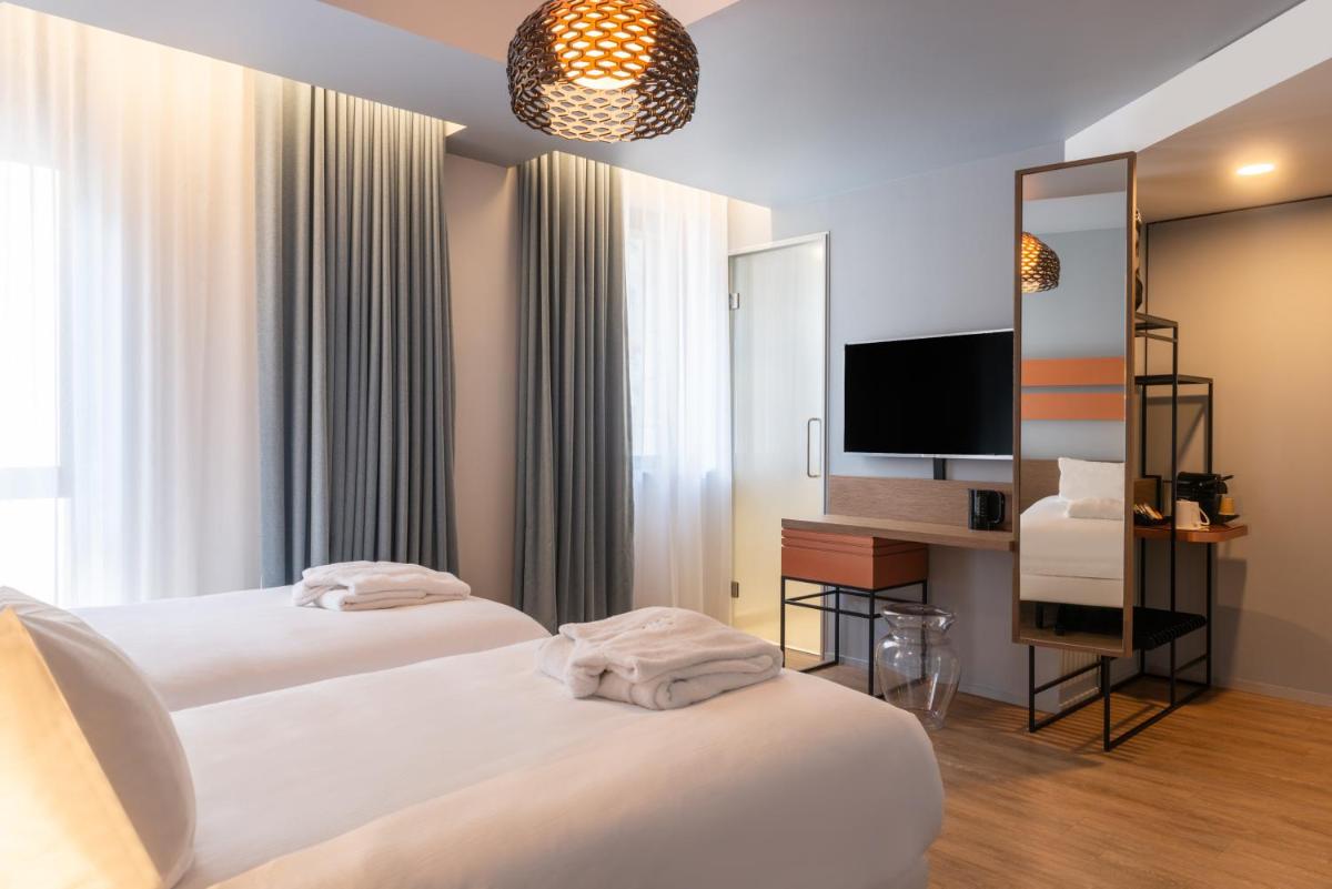 Un ou plusieurs lits dans un hébergement de l'établissement Golden Tulip Saint Malo– Le Grand Bé