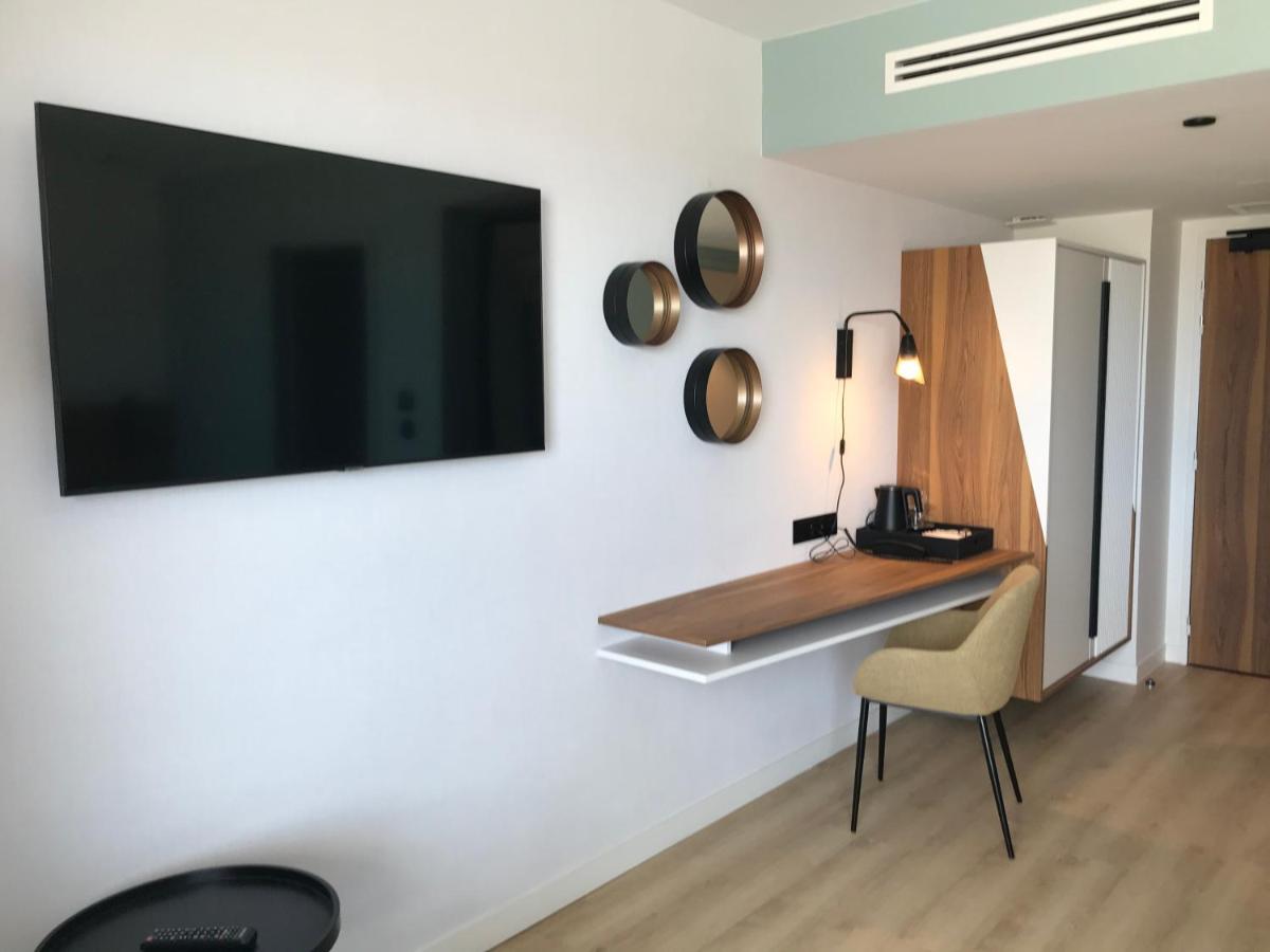 Télévision ou salle de divertissement dans l'établissement Radisson Blu Grand Hotel & Spa, Malo-Les-Bains