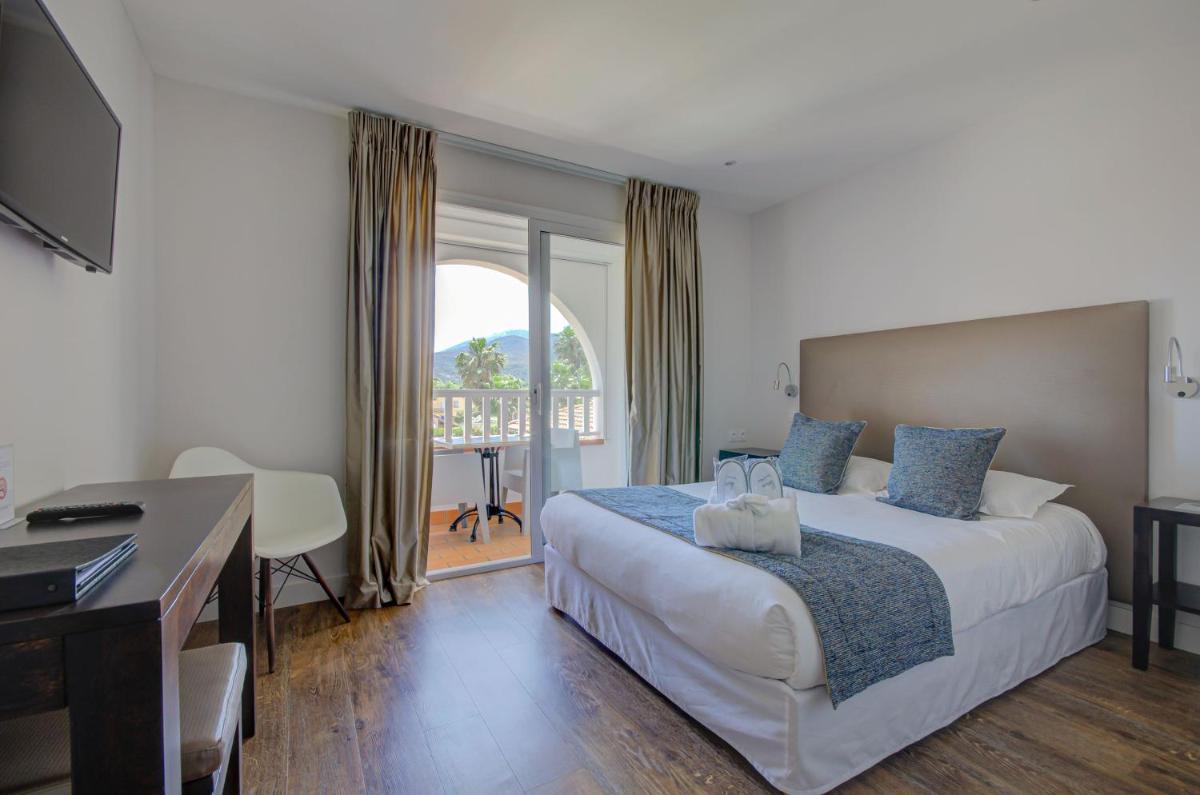 Un ou plusieurs lits dans un hébergement de l'établissement Le Cottage - Hotel & Spa