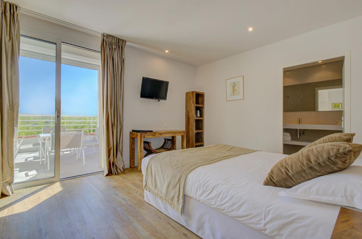 Un ou plusieurs lits dans un hébergement de l'établissement Le Cottage - Hotel & Spa