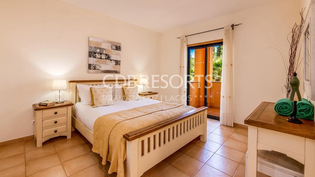 Uma cama ou camas num quarto em Estrela da Luz Resort