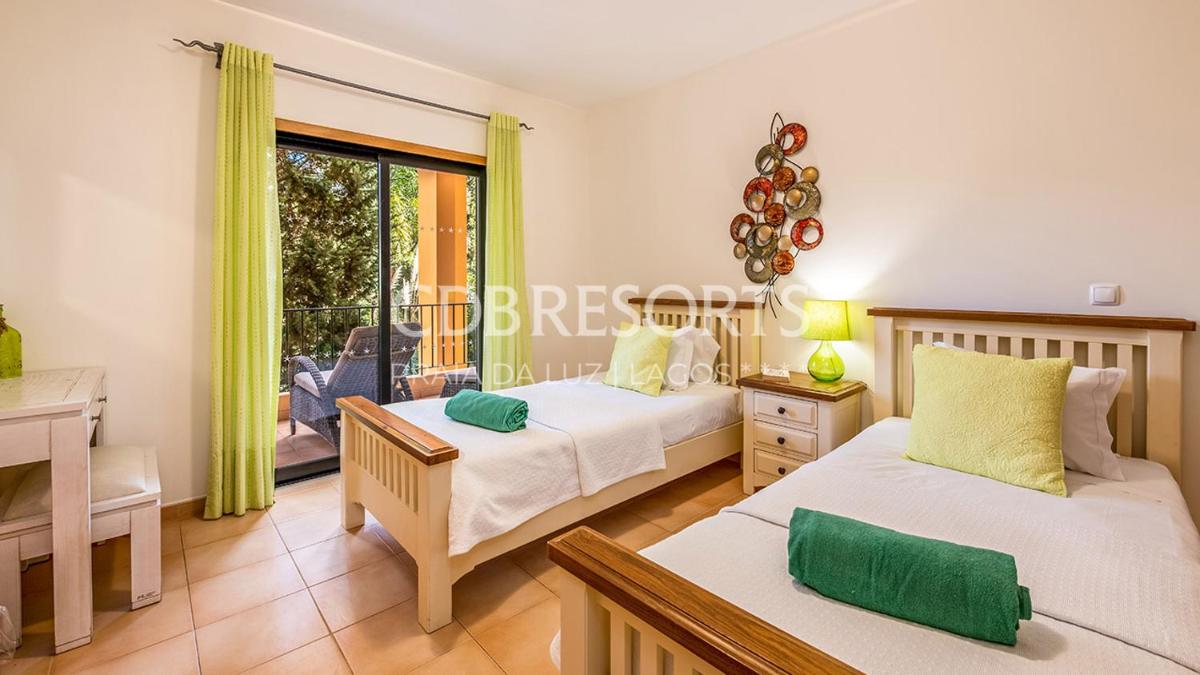 Uma cama ou camas num quarto em Estrela da Luz Resort