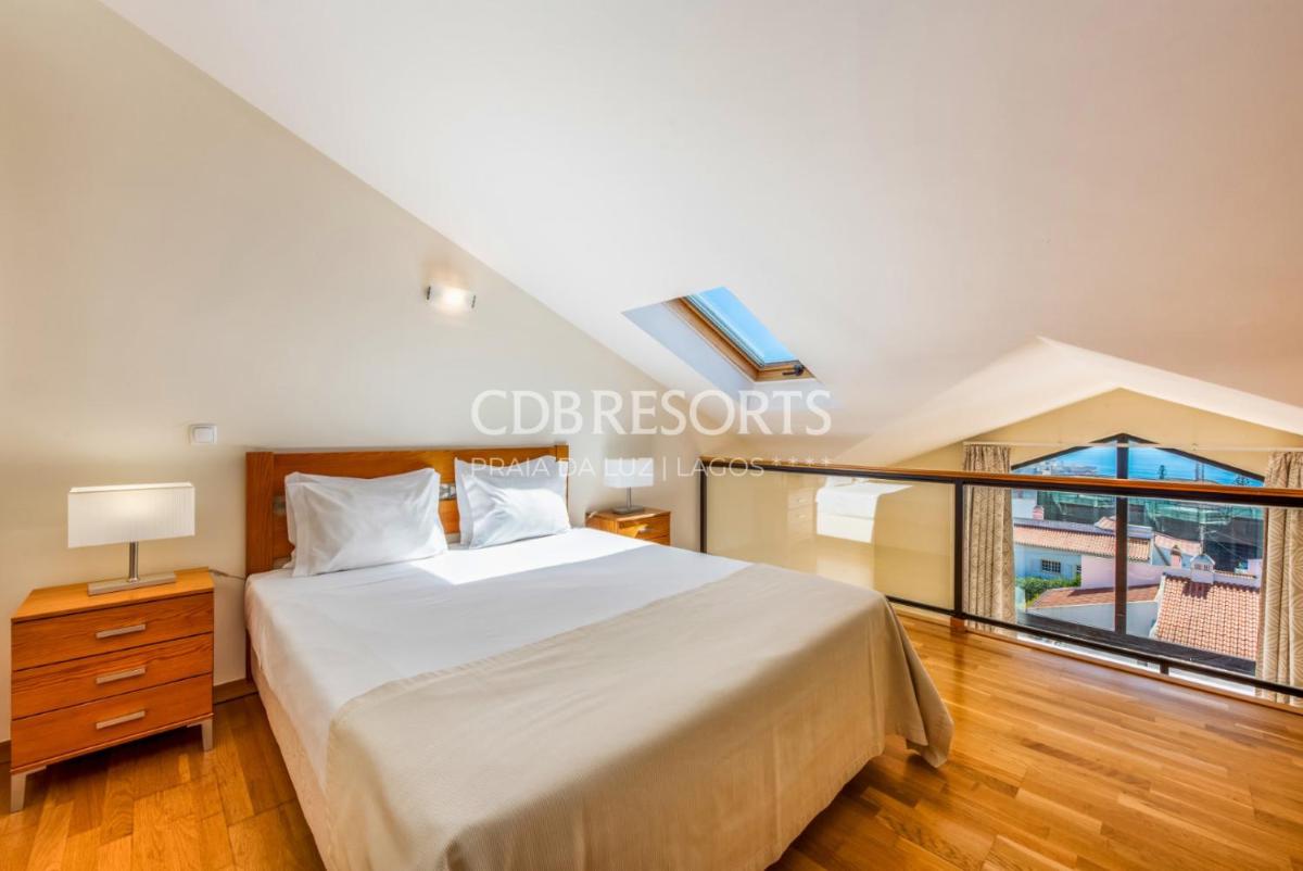 Uma cama ou camas num quarto em Estrela da Luz Resort