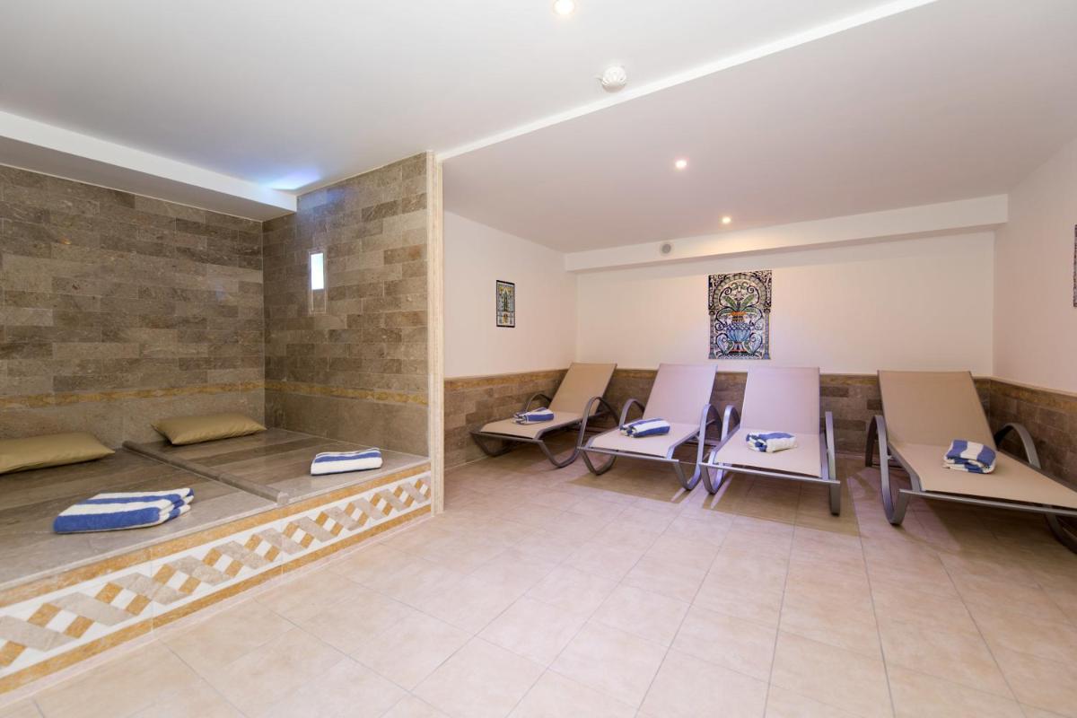 Coin salon dans l'établissement Alexain Hotel Restaurant & Wellness - Colmar Ouest