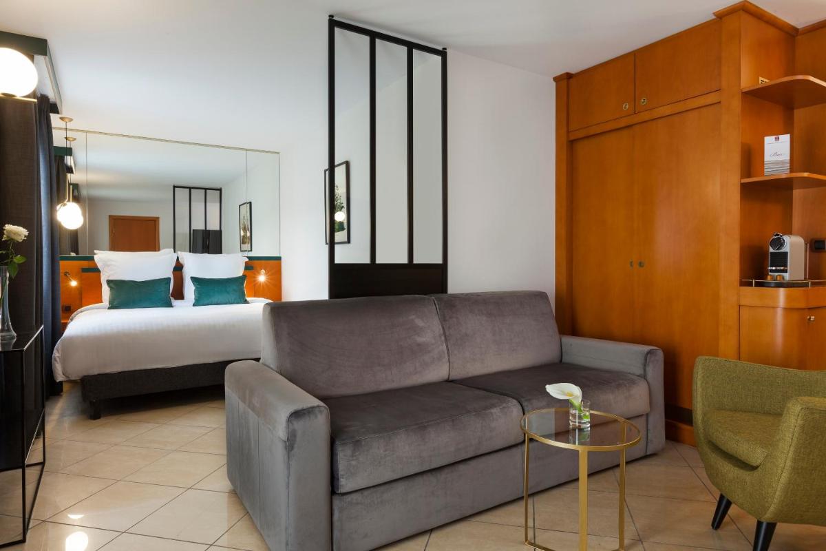 Un ou plusieurs lits dans un hébergement de l'établissement Nehô Suites Cannes Croisette