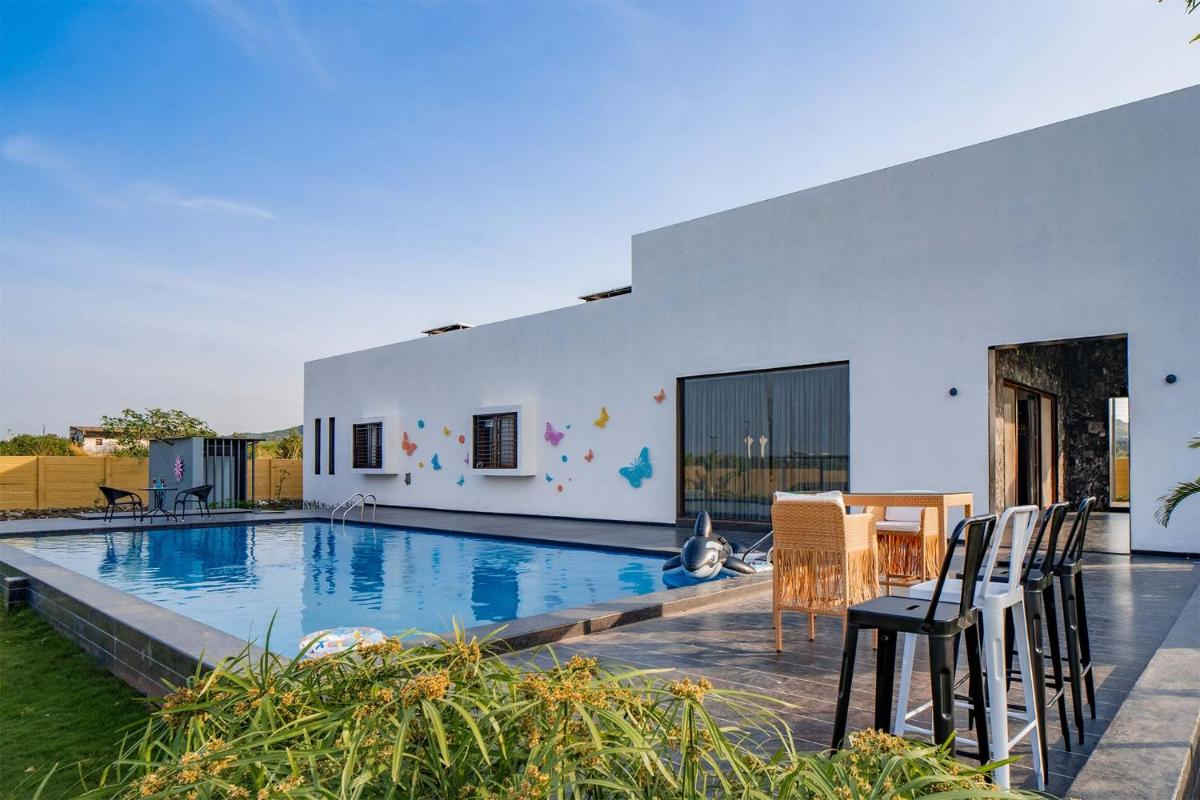 StayVista's Le Bon Horizon - Hillside Elegance with Chic Interiors, Poolside Serenity & Picturesque Gazebo - Proximity to Sula - Housity
