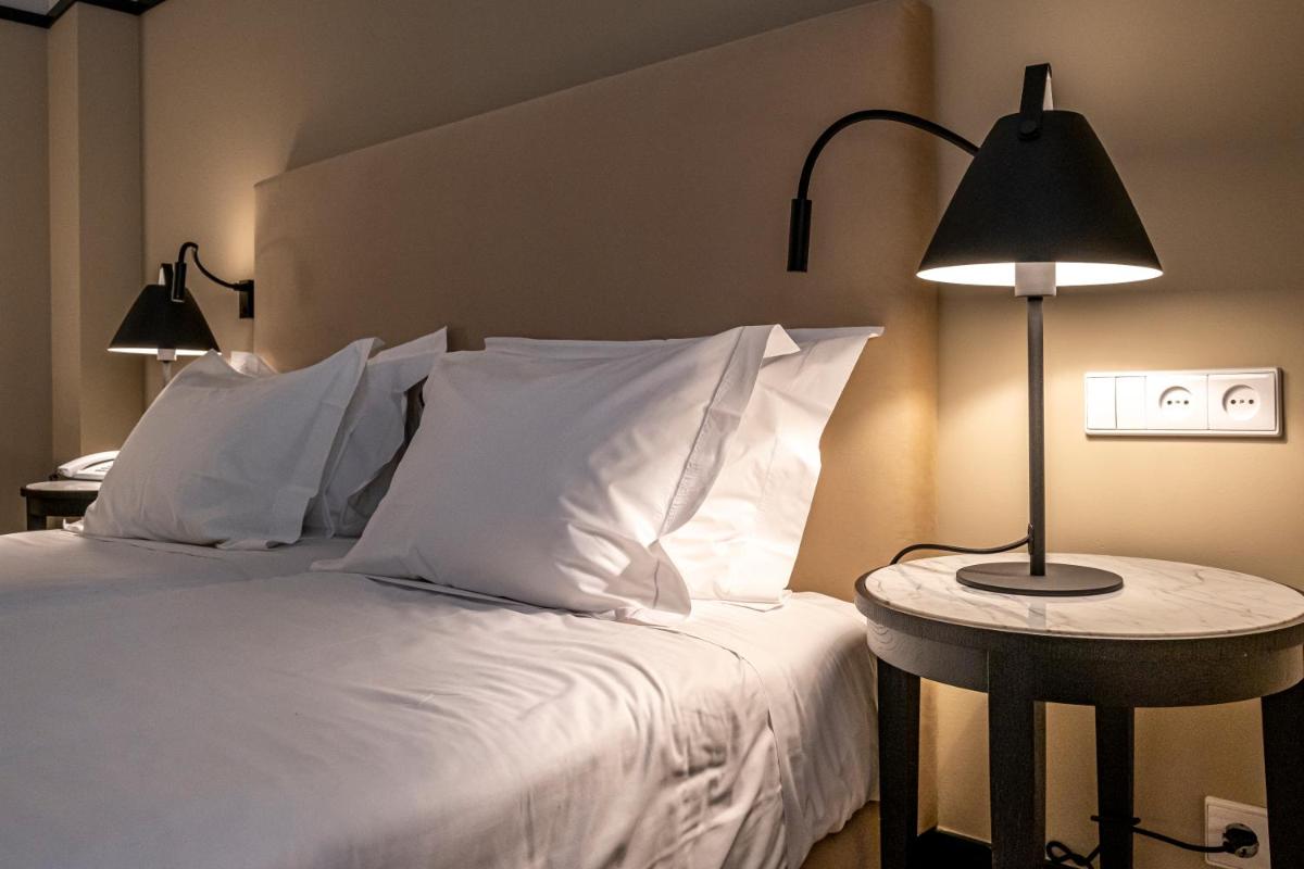 Uma cama ou camas num quarto em Octant Lousa