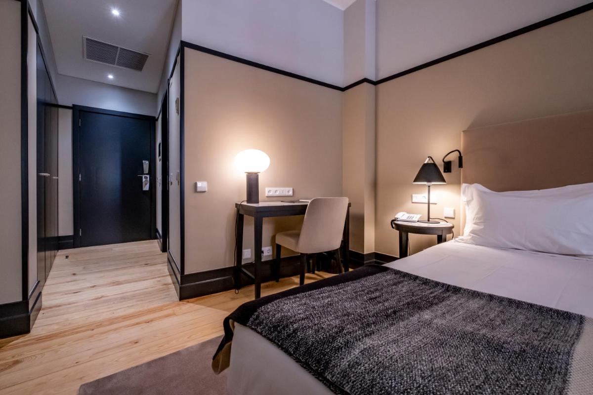 Uma cama ou camas num quarto em Octant Lousa