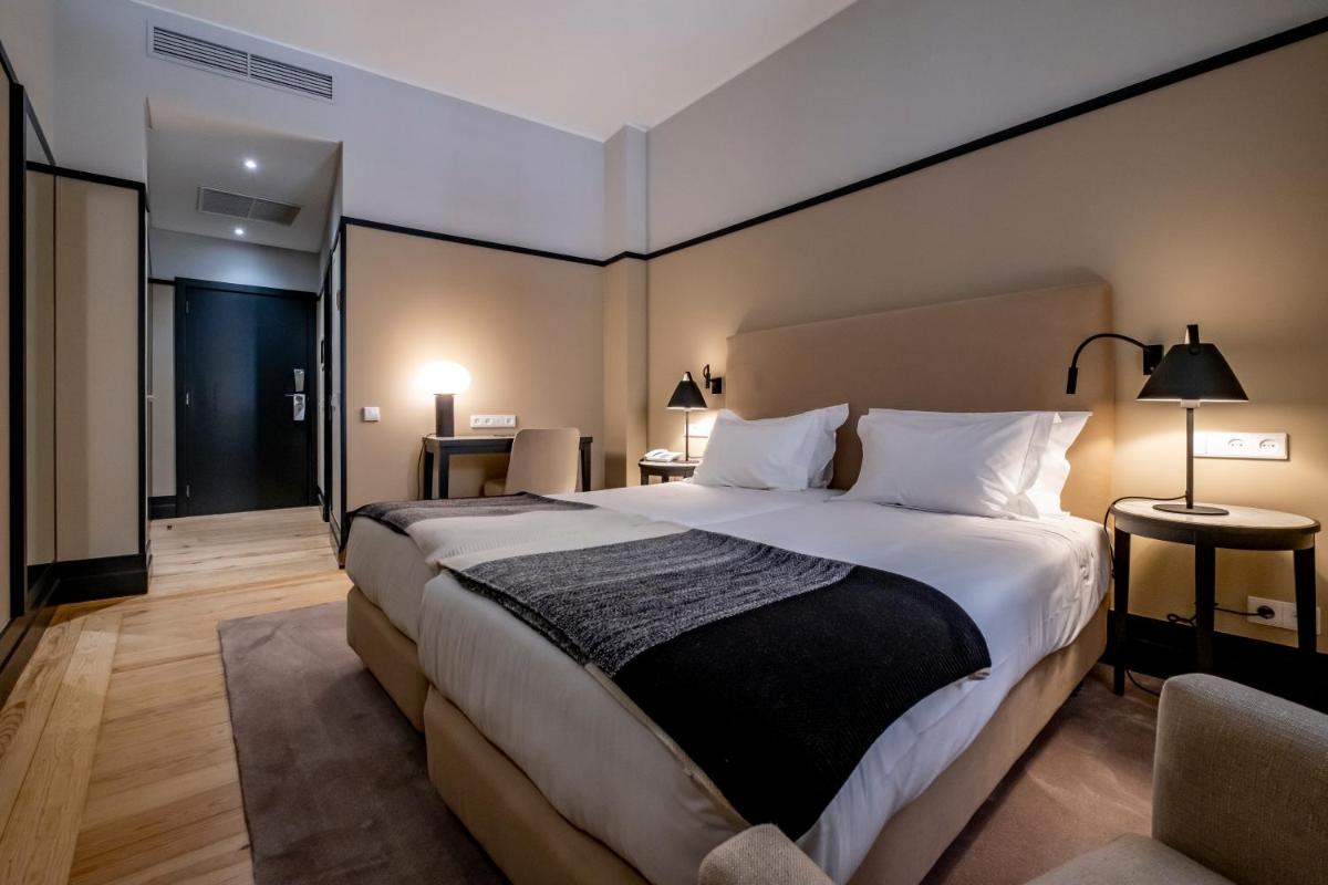 Uma cama ou camas num quarto em Octant Lousa