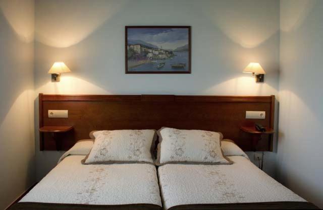 Cama o camas de una habitación en Hotel & Spa Villa de Mestas