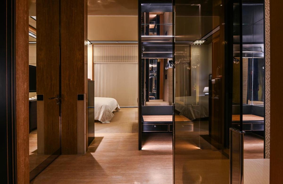 a dressing room with a chair and a mirror at Grand Hyatt Gurgaon in Gurgaon