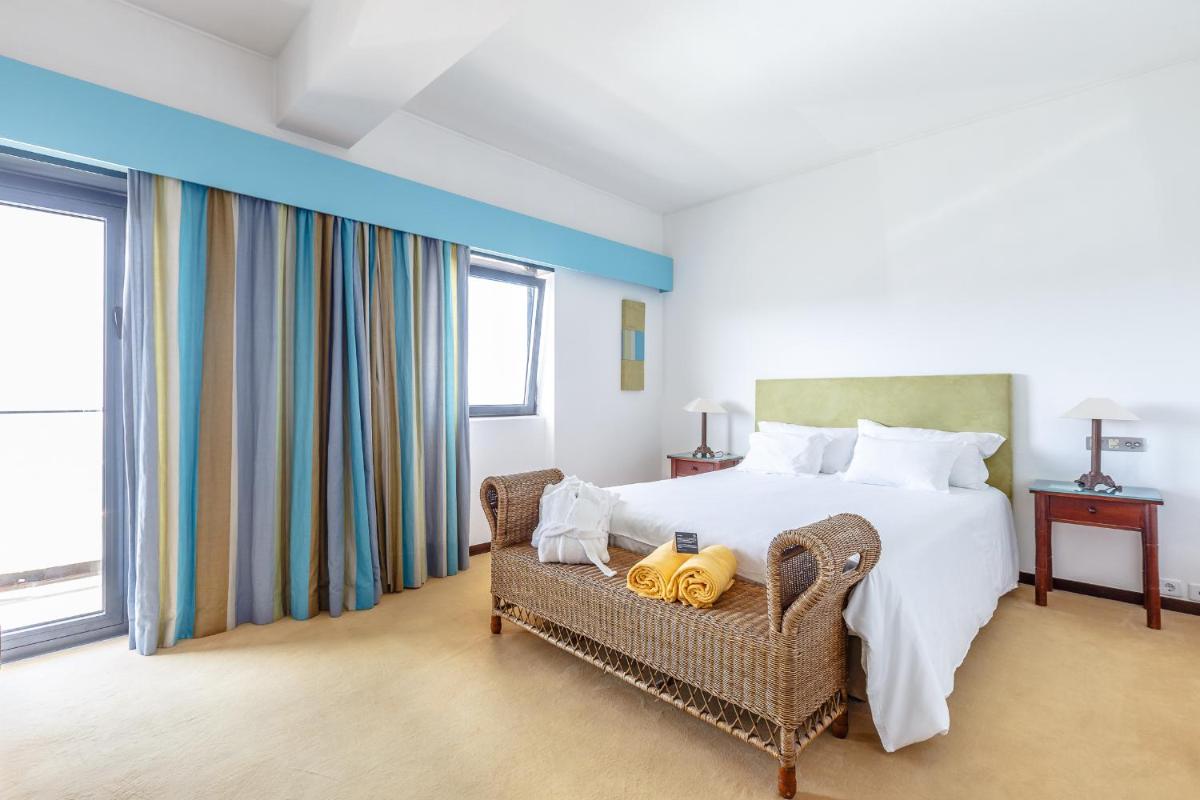 Uma cama ou camas num quarto em Hotel Golf Mar
