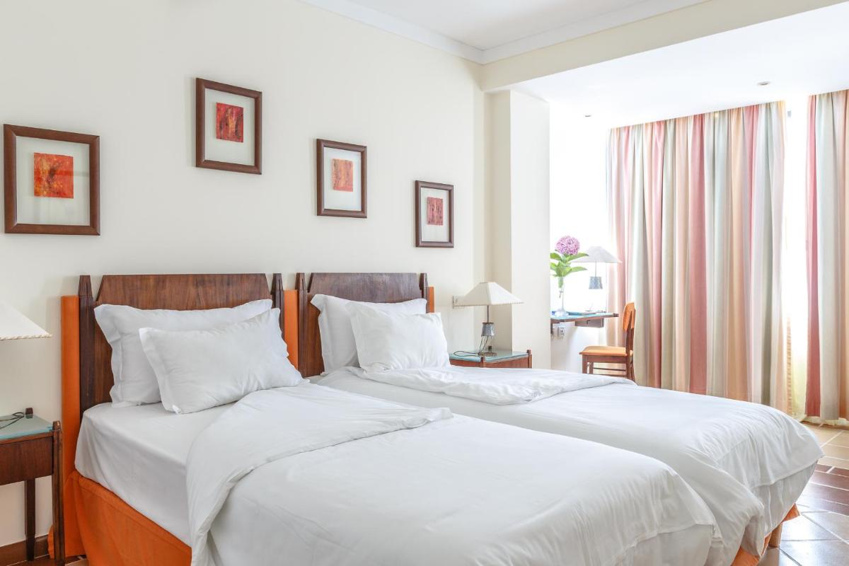 Uma cama ou camas num quarto em Hotel Golf Mar