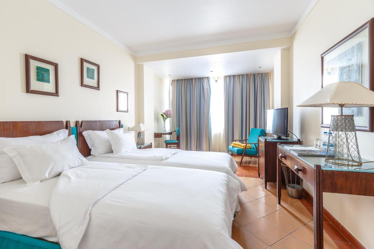 Uma cama ou camas num quarto em Hotel Golf Mar
