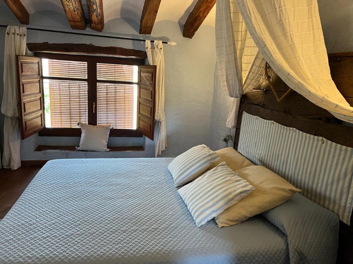 Cama o camas de una habitación en Les Vinyes Alojamiento Rural Boutique & SPA