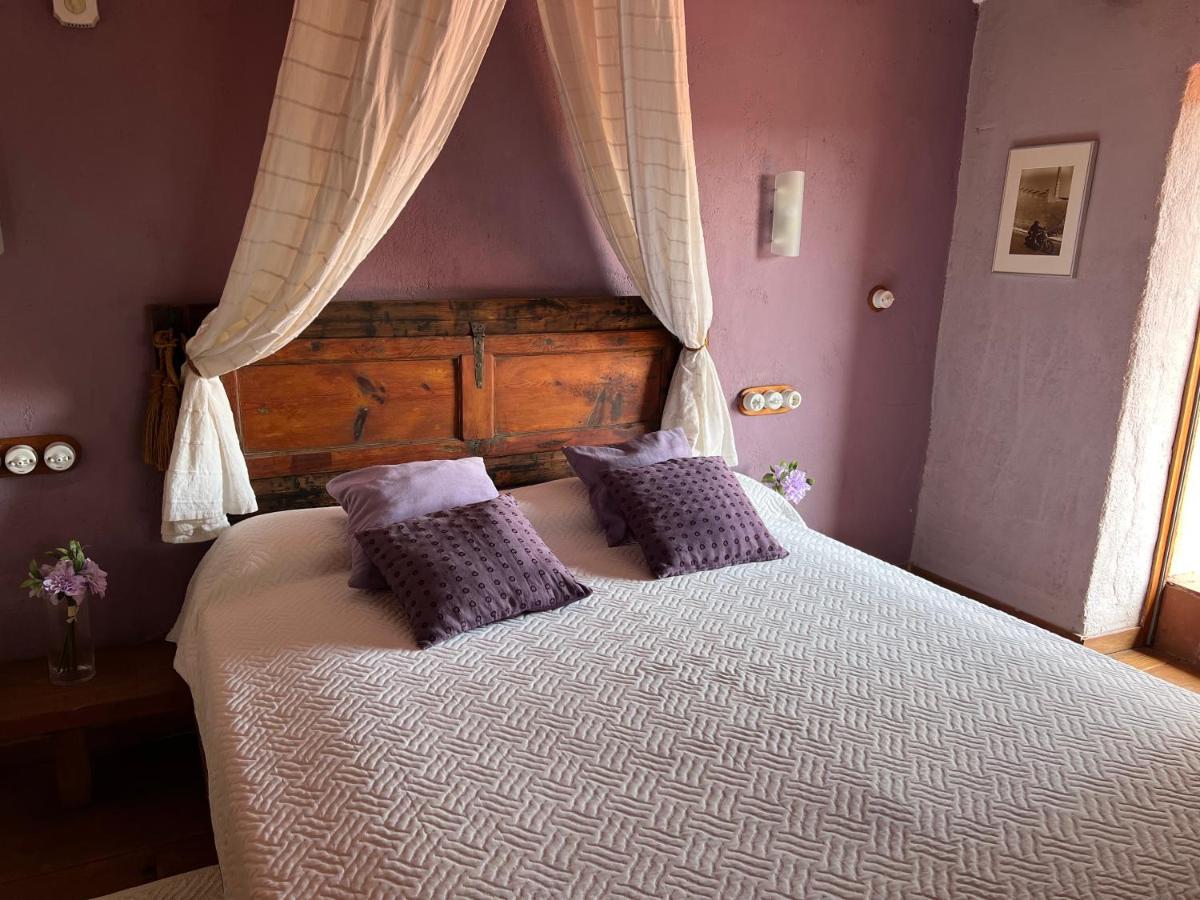 Cama o camas de una habitación en Les Vinyes Alojamiento Rural Boutique & SPA