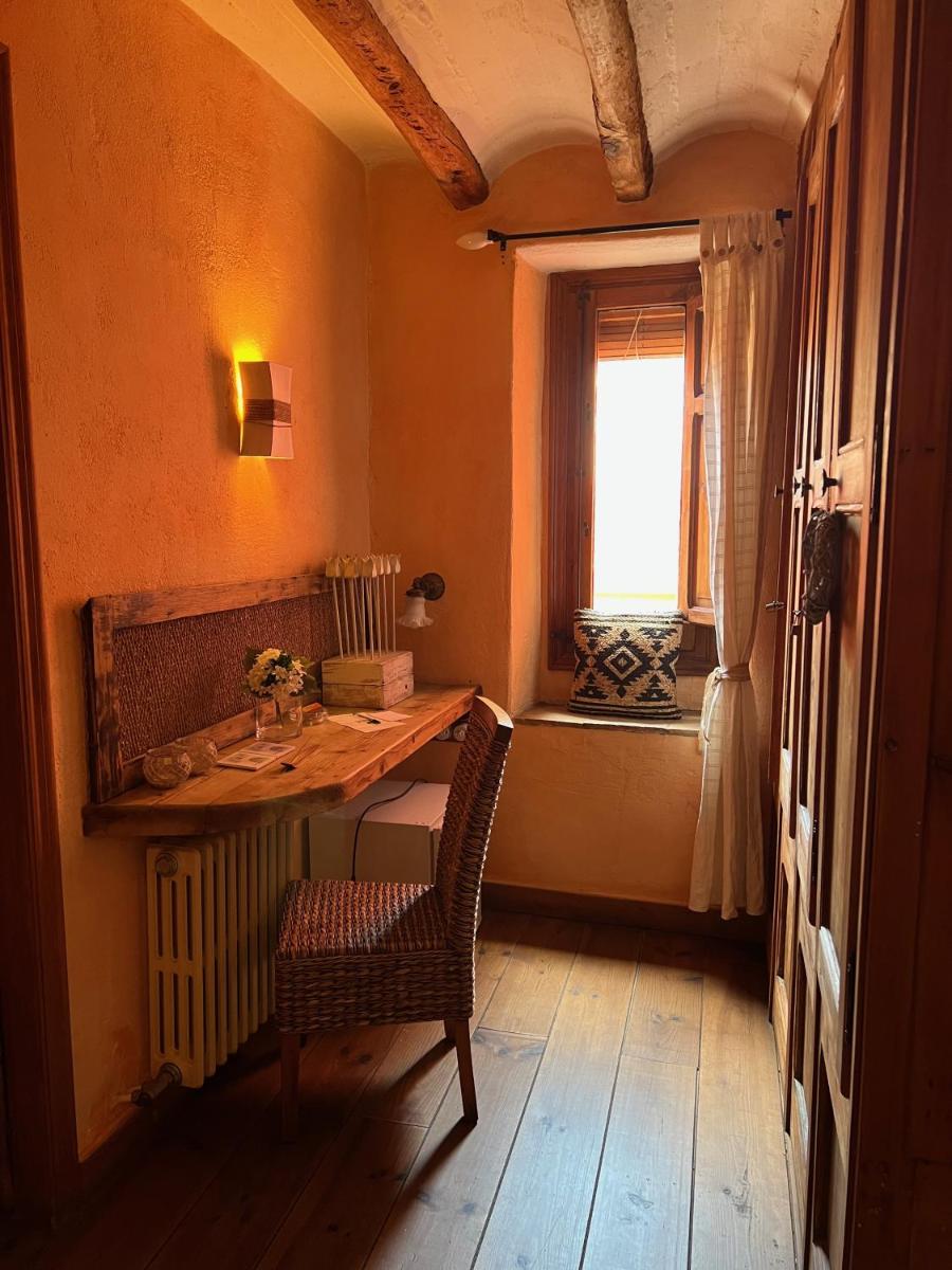 Cama o camas de una habitación en Les Vinyes Alojamiento Rural Boutique & SPA