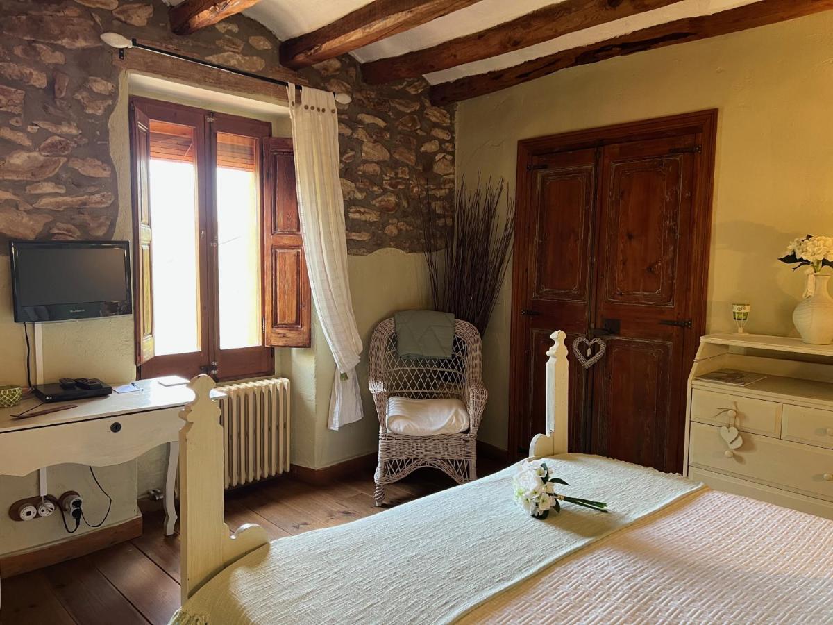 Cama o camas de una habitación en Les Vinyes Alojamiento Rural Boutique & SPA