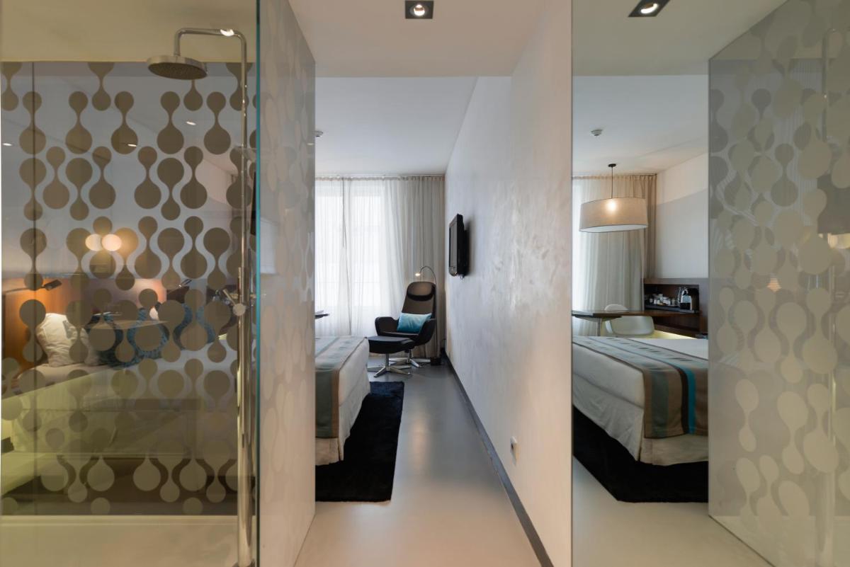 Uma cama ou camas num quarto em Inspira Liberdade Boutique Hotel