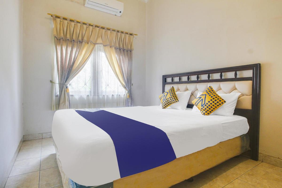 SPOT ON 91620 Skypiea Guest House - Housity
