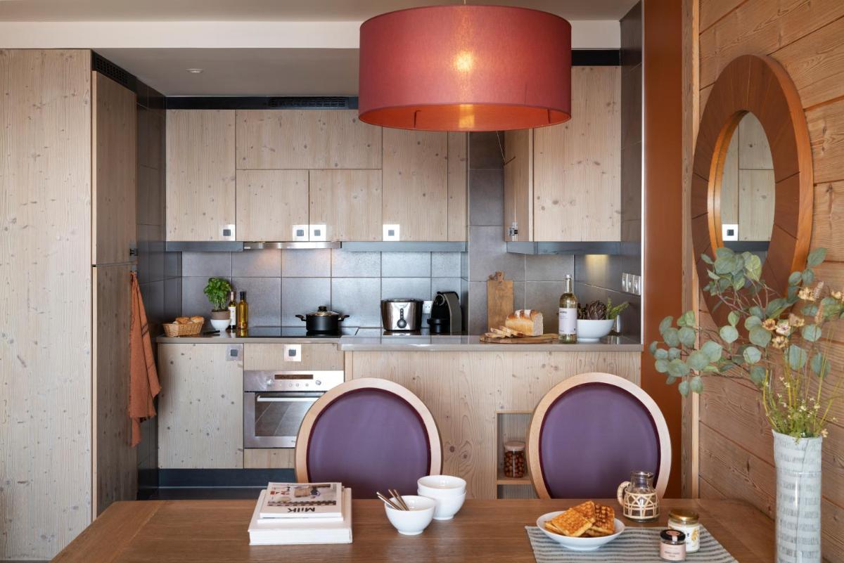 Cuisine ou kitchenette dans l'établissement Résidence Pierre & Vacances Premium L'Amara