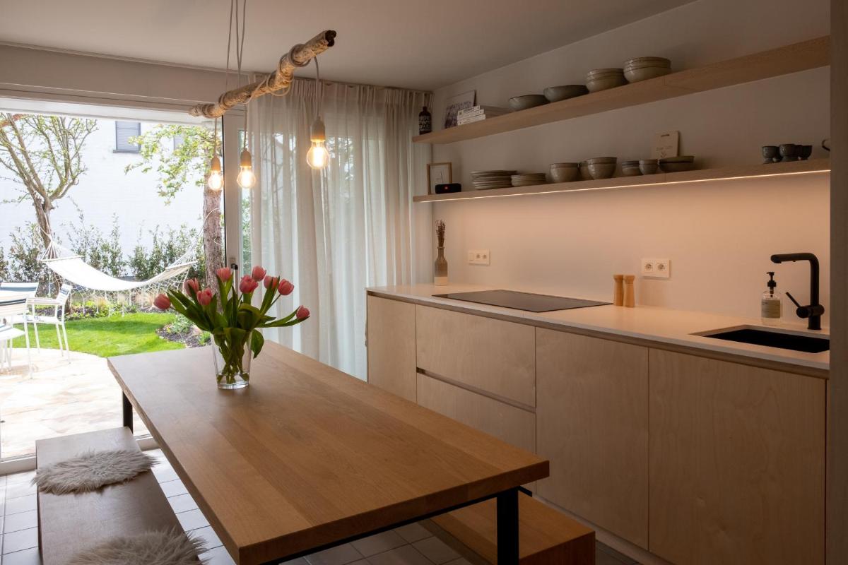 'A little white house with a tree by the sea' with beach cabin by BLOSS - Housity