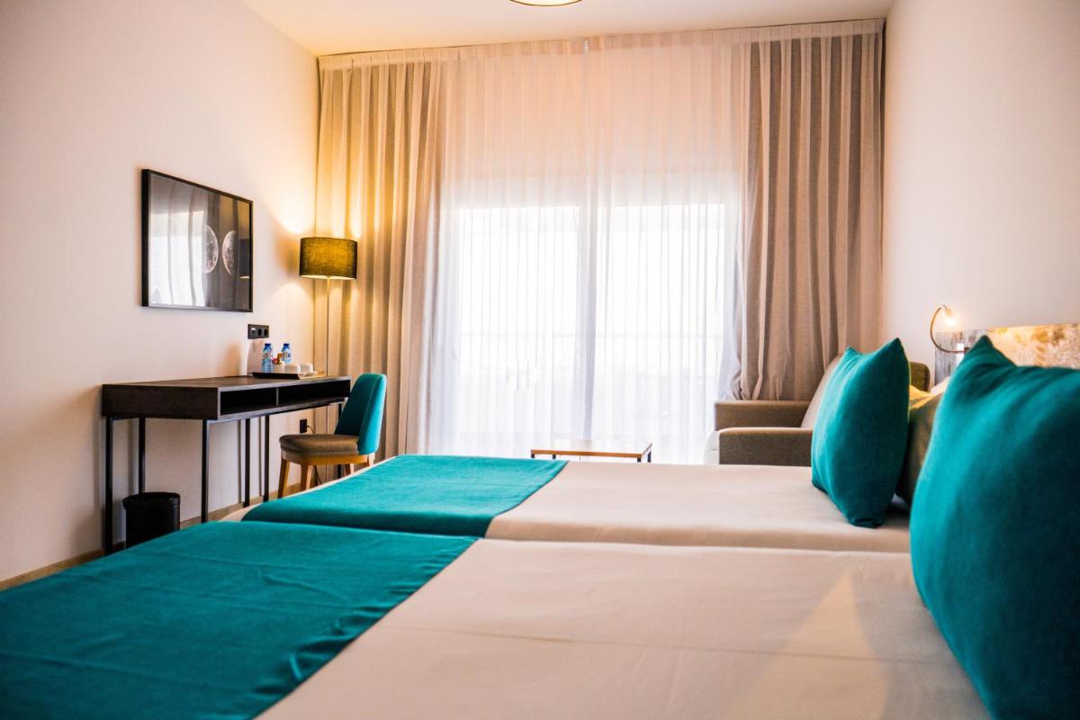 Cama o camas de una habitación en Moon Hotel & SPA.