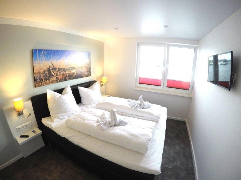 Ein Bett oder Betten in einem Zimmer der Unterkunft Schwimmende Häuser im BALTIC SEA RESORT
