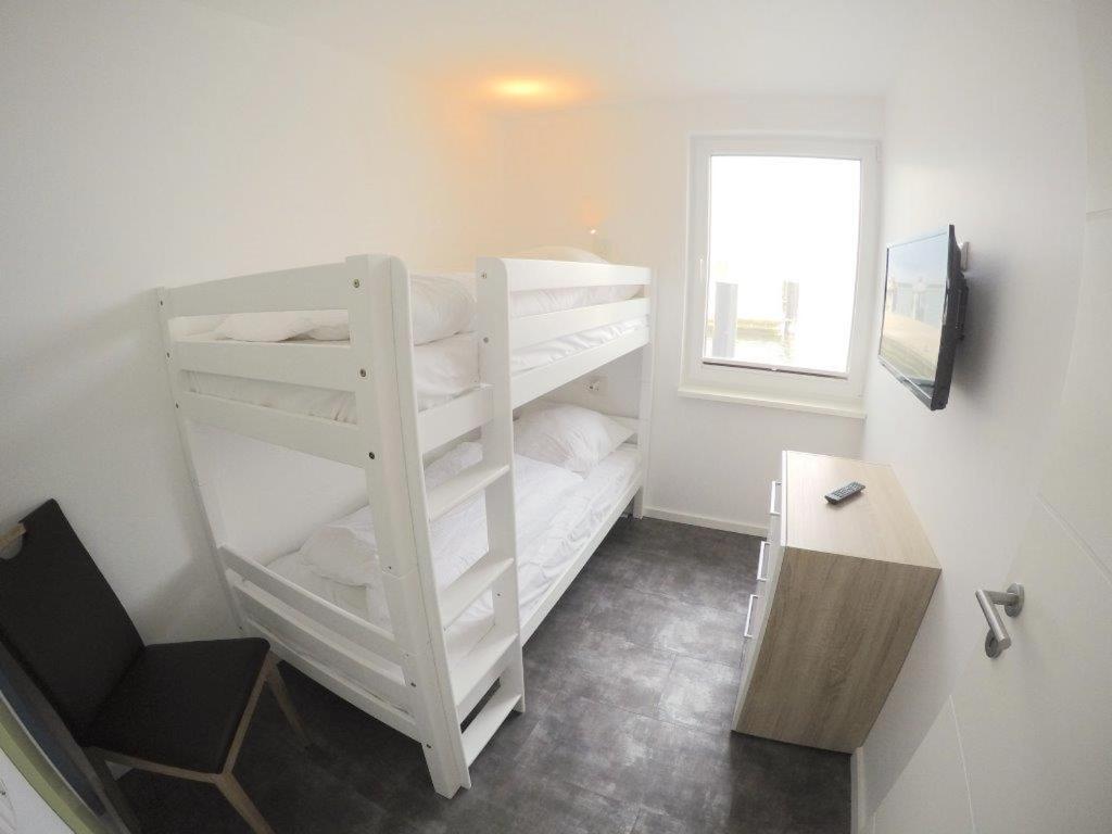 Ein Bett oder Betten in einem Zimmer der Unterkunft Schwimmende Häuser im BALTIC SEA RESORT