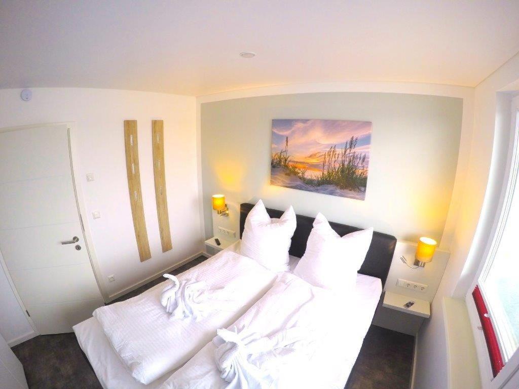 Ein Bett oder Betten in einem Zimmer der Unterkunft Schwimmende Häuser im BALTIC SEA RESORT