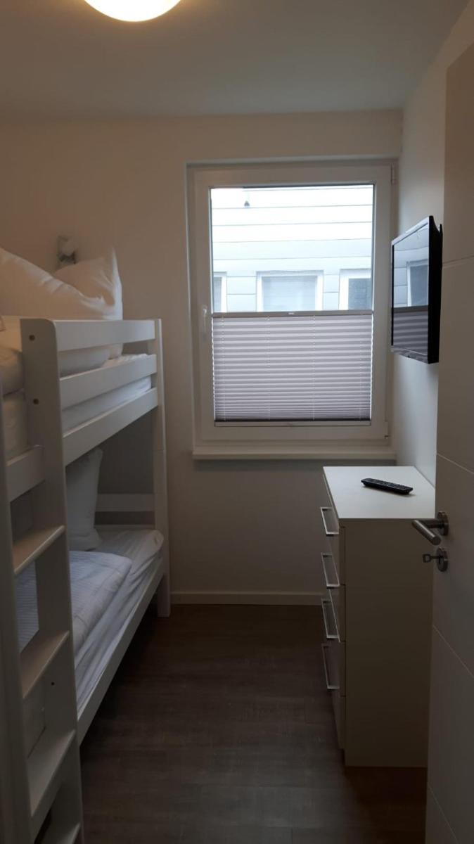 Ein Bett oder Betten in einem Zimmer der Unterkunft Schwimmende Häuser im BALTIC SEA RESORT