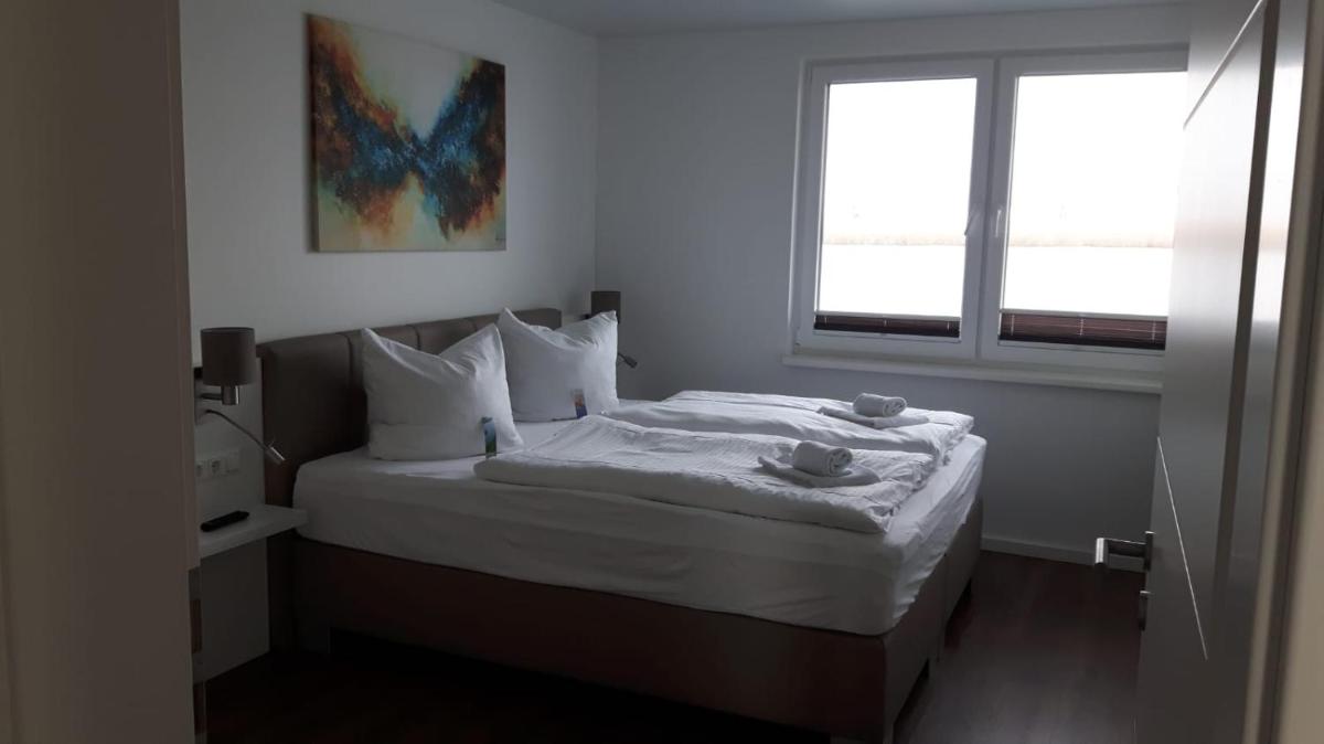 Ein Bett oder Betten in einem Zimmer der Unterkunft Schwimmende Häuser im BALTIC SEA RESORT