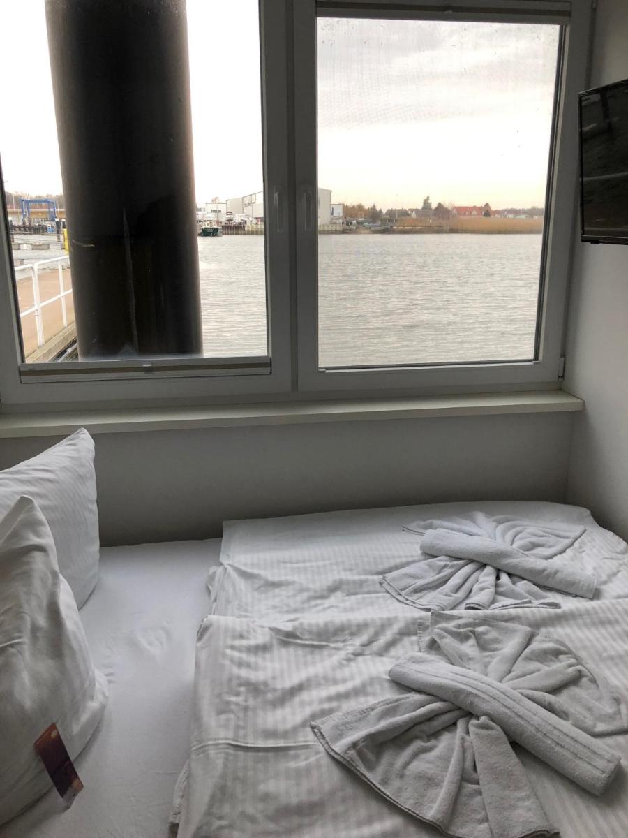 Ein Bett oder Betten in einem Zimmer der Unterkunft Schwimmende Häuser im BALTIC SEA RESORT