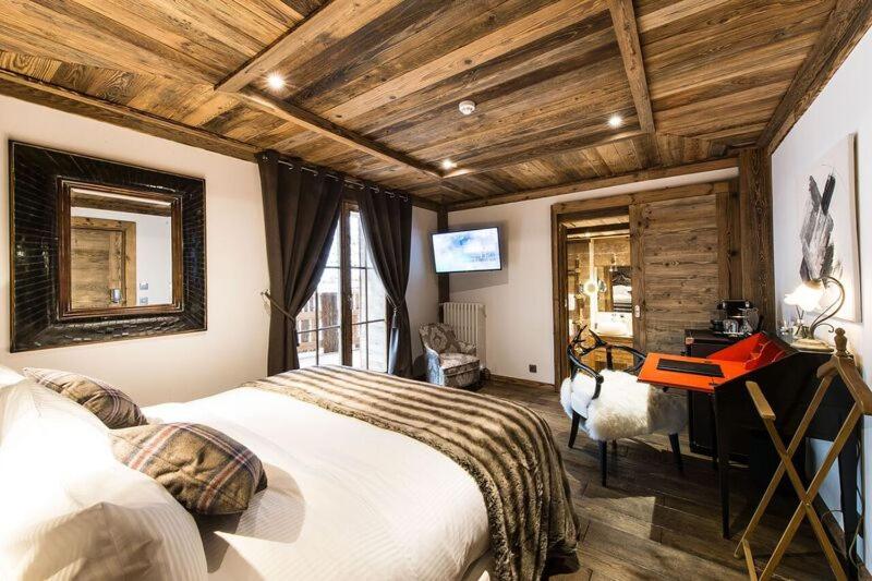 Un ou plusieurs lits dans un hébergement de l'établissement Le Chalet Blanc