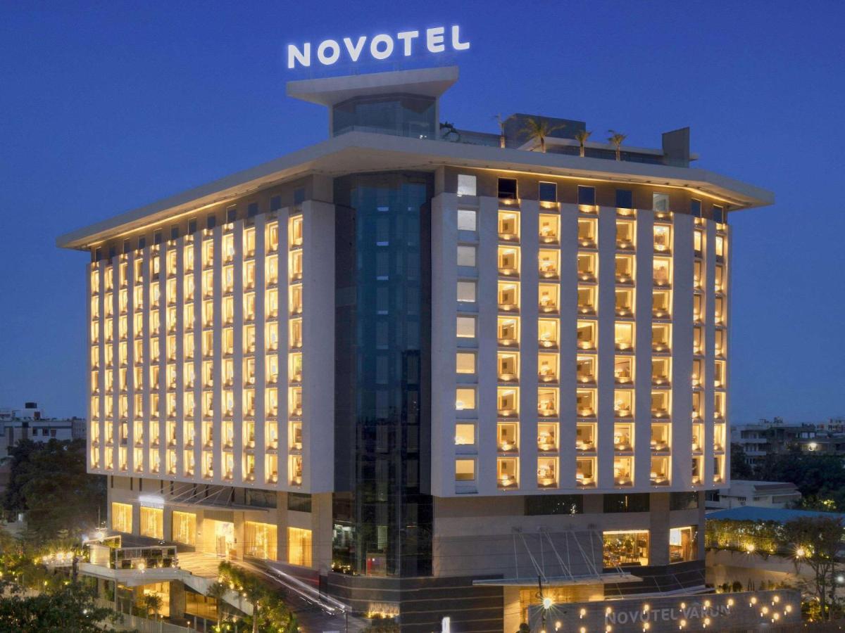 a hotel with a sign on top of a building at Novotel Vijayawada Varun in Vijayawāda
